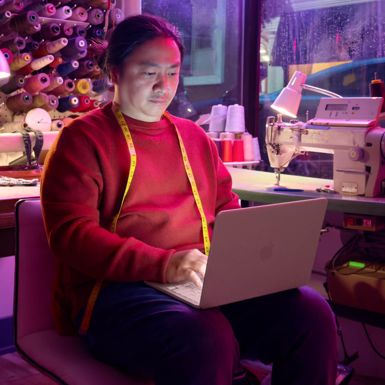 A man using the Apple MacBook Neo